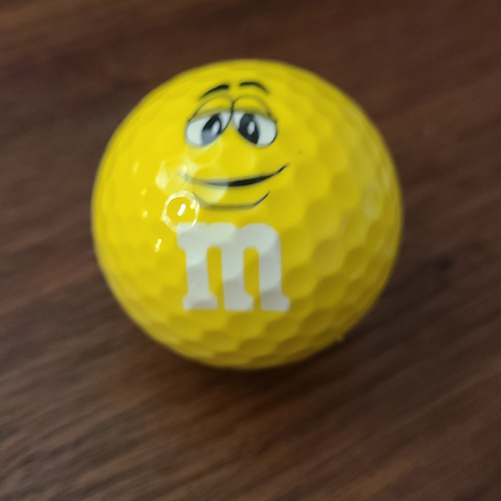 Yellow M&M golf ball